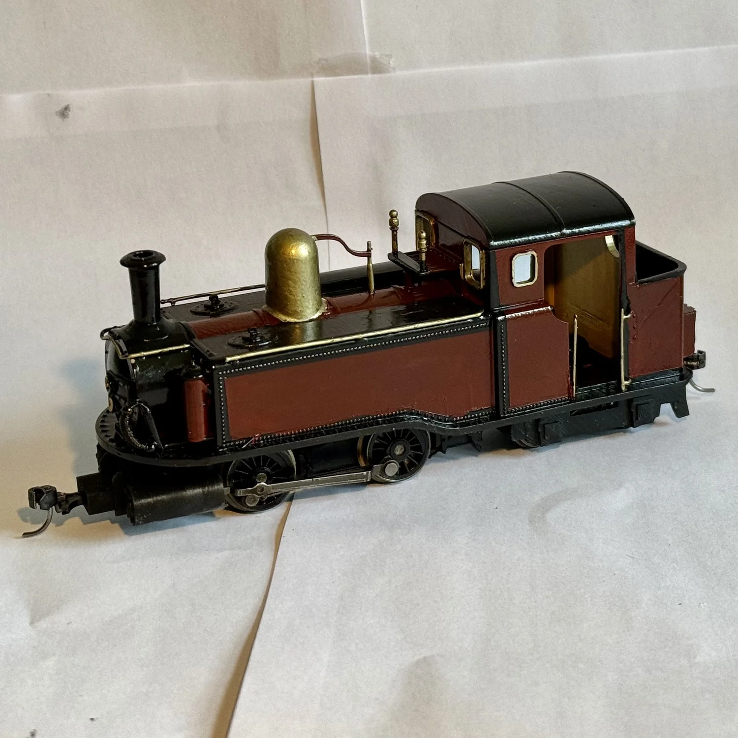 Taliesin-style Single Fairlie locomotive model on a display track