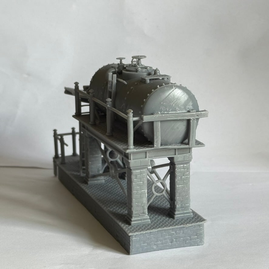 Three-quarter view of the diesel fuelling station model with raised tank and brick supports