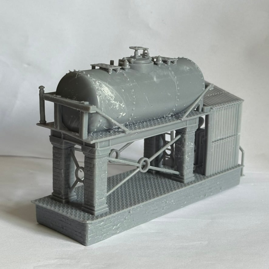 Side view of the diesel fuelling station model showing the tank, stone base, and cross bracing