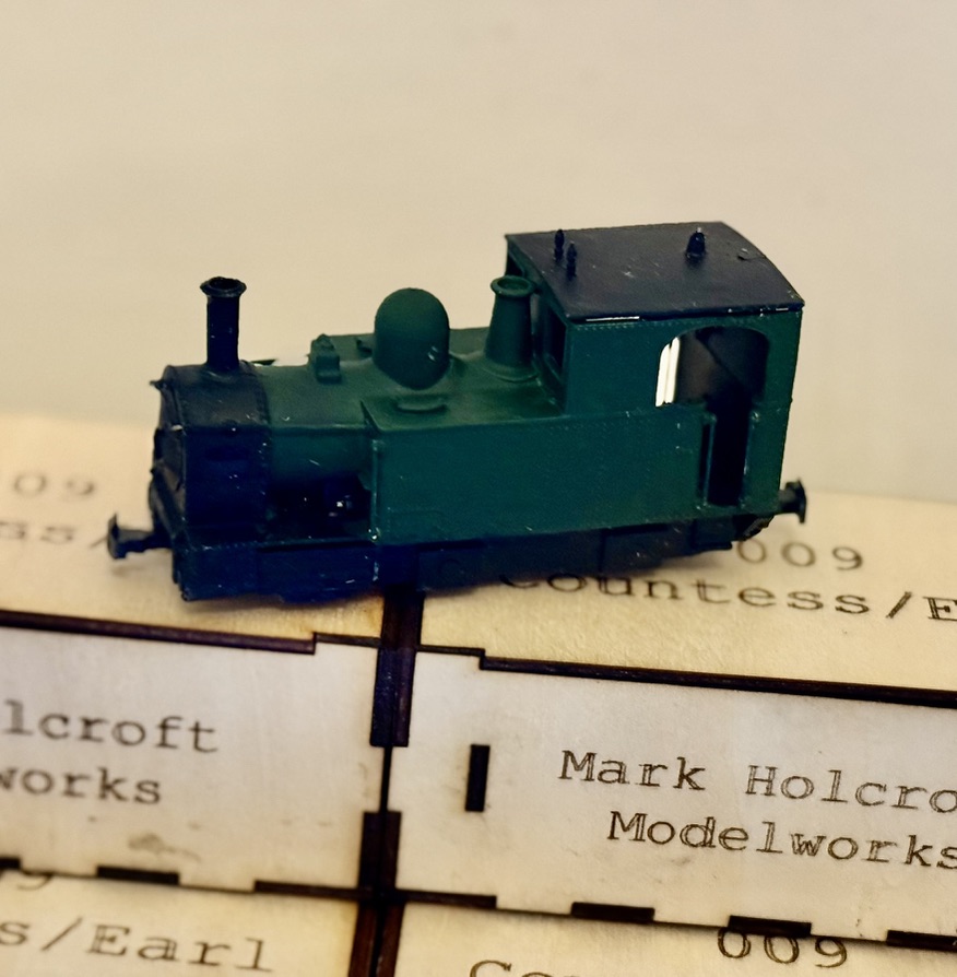 Painted green and black GWR Earl locomotive model shown side-on over the display base.