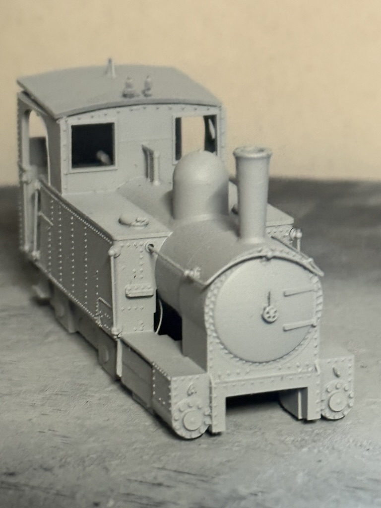 Close front three-quarter view of an unpainted GWR Earl locomotive print showing rivets and boiler front detail.
