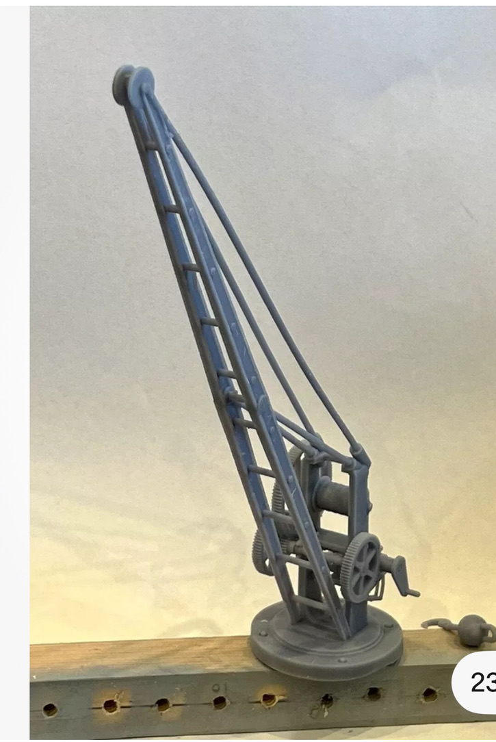 Side view of the printed wharfside crane showing the tall jib, pulley, base and gear assembly.