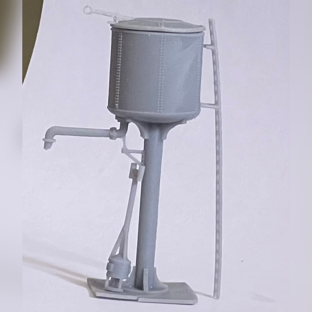 Side view of the printed water tower with the filler arm swung out, the ladder clipped to the tank and the heater flue running up the column.