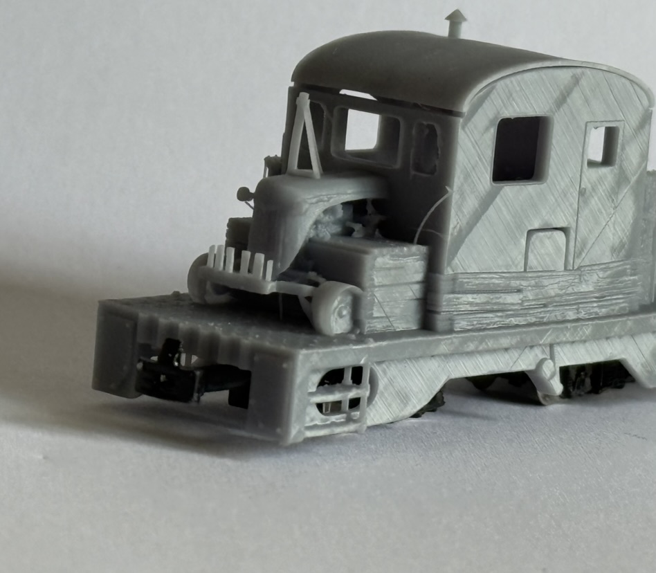 Front and side three-quarter view of the printed tractor loco showing the cab side, bonnet and underframe detail.