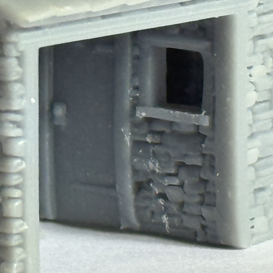 Close-up of the waiting room fireplace and interior stonework visible through the open front.
